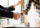 real-estate-agent-and-customers-shaking-hands